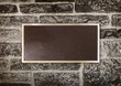 Foto: Sign in Metal Frame on a Wall Sign in Metal Frame on a Wall