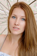 Beautiful young girl with parasol