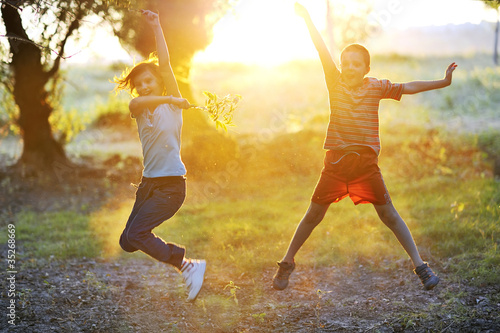 Photo: children play against the sun children play against the sun