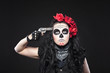Photo: Serious woman in skull mask shot in head Serious woman in skull mask shot in head