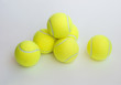 Six yellow tennis ball isolated on gray background