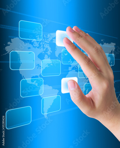 Photo: hand pushing a button on a touch screen interface hand pushing a button on a touch screen interface