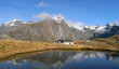Photo: Mountains and hut lake reflection Mountains and hut lake reflection