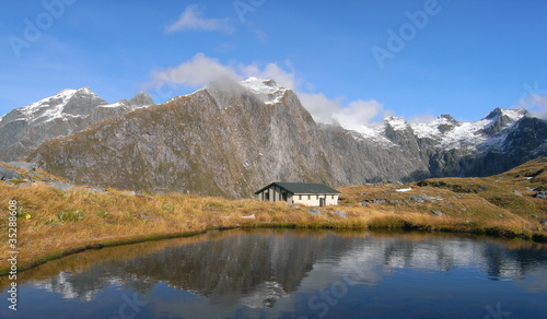 Photo: Mountains and hut lake reflection Mountains and hut lake reflection