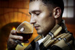 Taster. Man with glass of brandy or cognac Taster. Man with glass of brandy or cognac