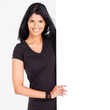 attractive young latin woman presenting white board