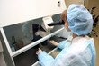 Young female doctor working with a microscope in a laboratory