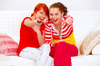 Smiling girlfriends watching TV