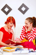 Two studying at home girlfriends surprised