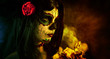 Artistic shot of sugar skull girl with dead roses