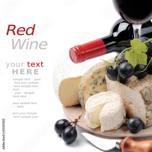 Photo: Red wine with French cheese selection over white Red wine with French cheese selection over white