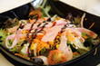 Salad on a black plate