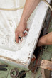 Plumber cleaning drain in bathroom Plumber cleaning drain in bathroom