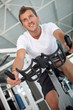 Man doing spinning at the gym
