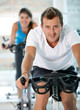 People doing spinning at the gym