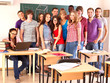 Student in classroom near blackboard.