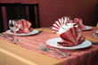 table setting with plates, napkin, silverware