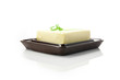 fresh butter in the butter dish on white background