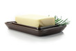 fresh butter with rosemary decoration in butter dish