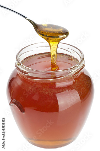 Photo: Honey spoon and jar Honey spoon and jar