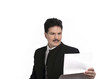 Man in suit looking at notes
