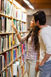 Portrait of students choosing a book