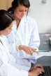 Portrait of female scientists looking at a report
