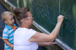 Photo: Boy drawing with chalk Boy drawing with chalk