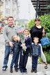 Happy young family with three sons outdoors