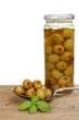 Jar of olives and spoon