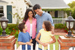 Hispanic family outside home