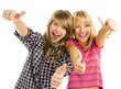 Portrait of happy teen girls showing thumbs up over white Portrait of happy teen girls showing thumbs up over white