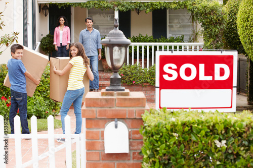 Photo: Family moving into new home Family moving into new home