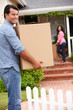 Hispanic couple moving into new house