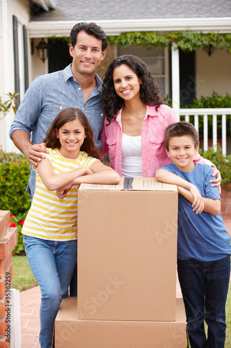 Photo: Family moving into new house Family moving into new house