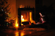 Young mother and daughter by a fireplace on Christmas