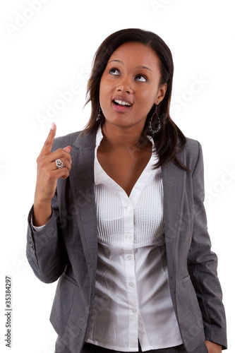 Photo: Young african american business woman looking up Young african american business woman looking up