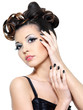 Sexy woman with creative hairstyle and black nails