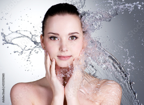 Photo: Splashes of water on the face of beautiful sexy woman Splashes of water on the face of beautiful sexy woman