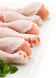 Raw chicken legs on white background