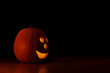 Halloween pumpkin with copy space (black background)