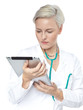 Foto: Female doctor reading on the internet with touchpad Female doctor reading on the internet with touchpad