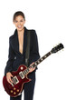 Young female in suit playing electric guitar