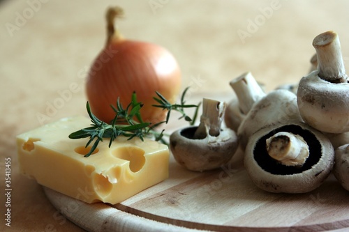 Photo: Kitchen-stuff on a board for concoction of meal Kitchen-stuff on a board for concoction of meal