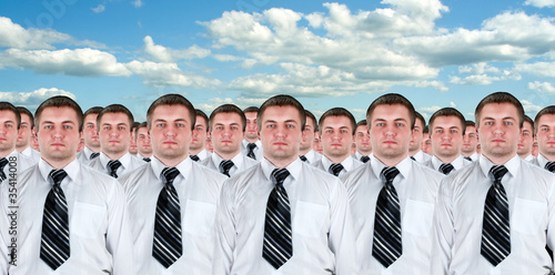 Photo: Many identical businessmen clones Many identical businessmen clones