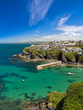 Cove and harbour of Port Isaac with blue skies, Cornwall