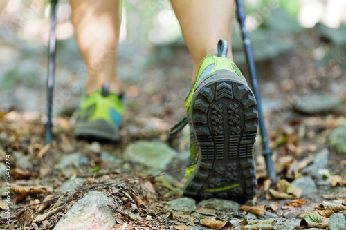 Photo: Woman exercising in forest, nordic walking Woman exercising in forest, nordic walking