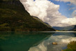 Clouds are reflected in water of the fjord Clouds are reflected in water of the fjord