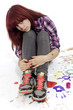 Portrait of young teenager drawing with motley paints