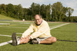 middle age senior man exercising on sports field middle age senior man exercising on sports field